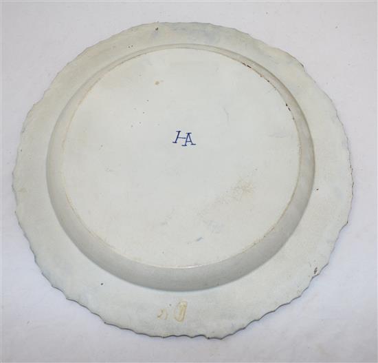 A pair of pearlware blue and white dishes and another similar pearlware dish, late 18th century, both diam. 35.5cm